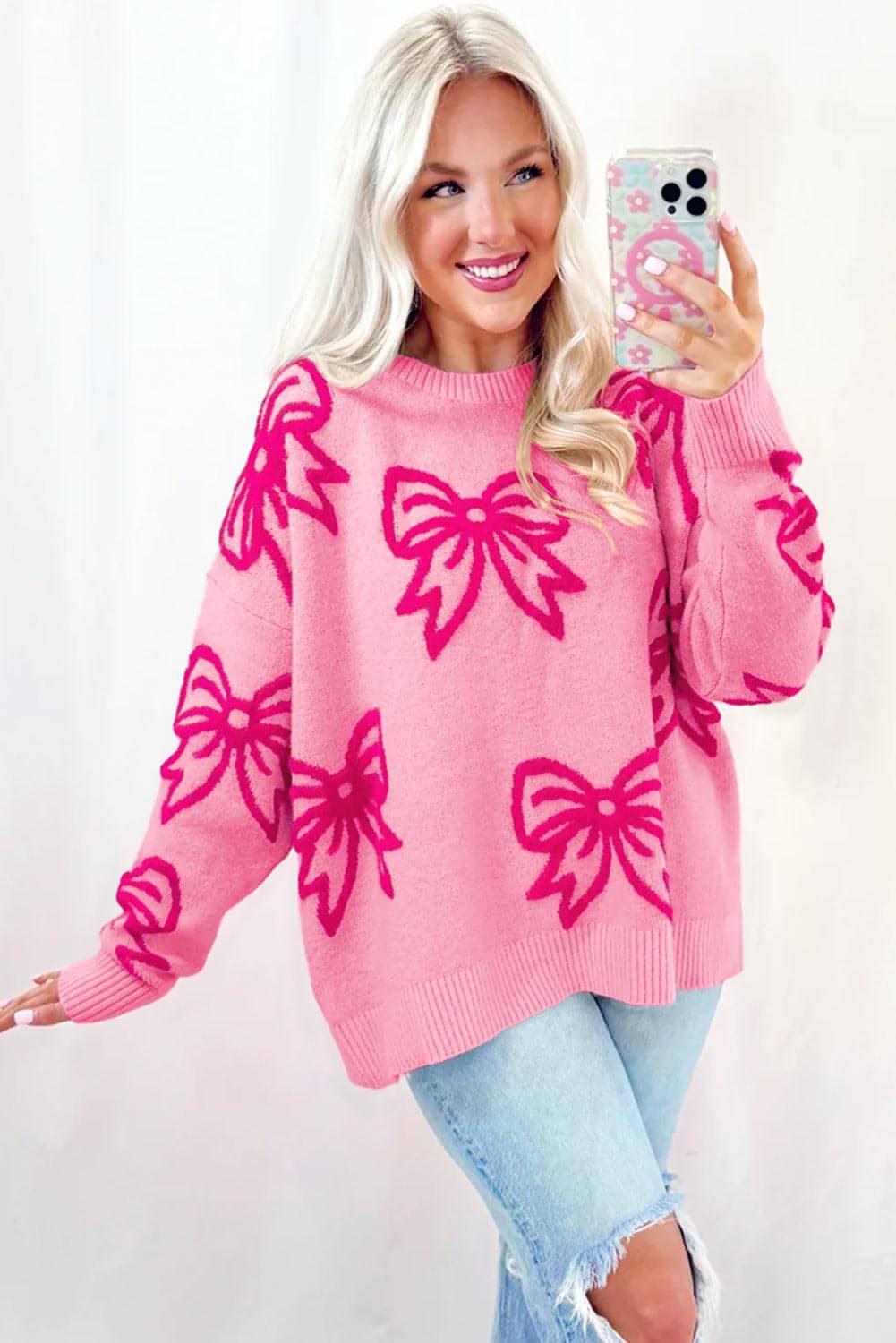 Maglione ampio con spalle scoperte con motivo fiocco rosa