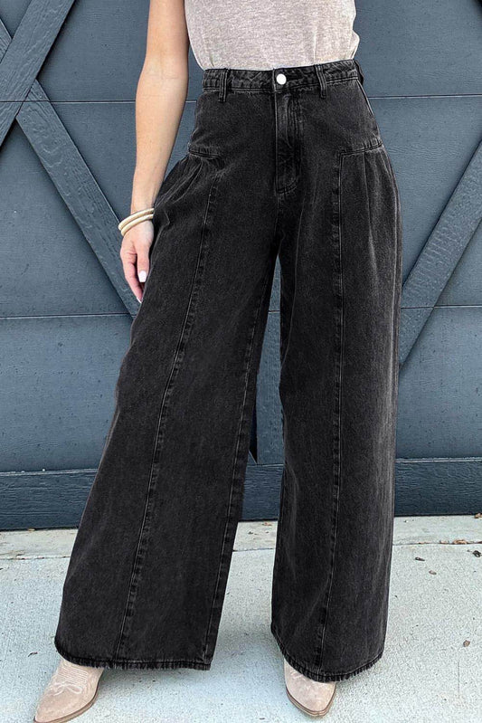 Pantalon en denim gris foncé plissé à jambe large et délavé minéral