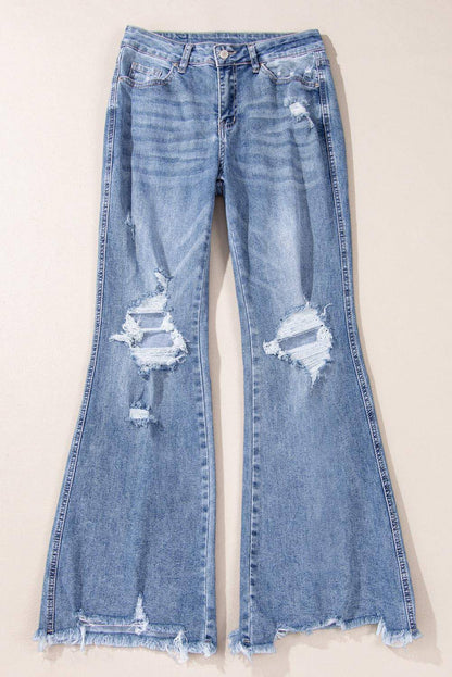 Dunkelblaue, hoch sitzende, zerrissene, ausgestellte Jeans mit Distressed-Saum