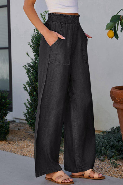 Schwarze Seitentaschen geschnappt smocked hohe Taillenweite mit weiten Beinjeans