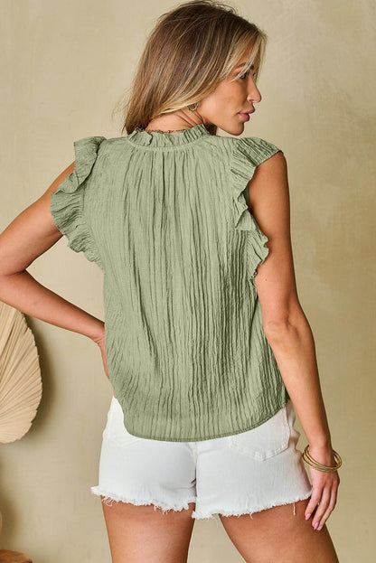 Weidemistgroene blouse met V-hals en fladdermouwen