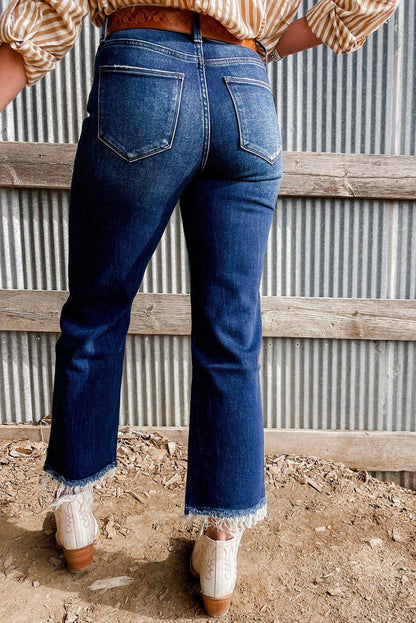 Jeans svasati a vita alta con lavaggio minerale blu vela e orlo grezzo