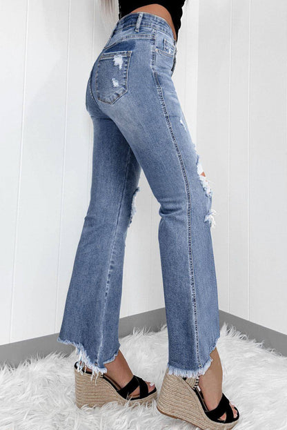 Dunkelblaue, hoch sitzende, zerrissene, ausgestellte Jeans mit Distressed-Saum