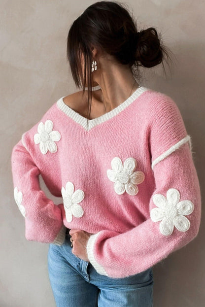 Maglione con spalle scese con scollo a V e fiori rosa