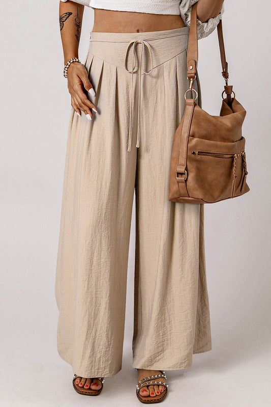 Pantalones casuales de pierna ancha plisados ​​con cintura con cordón en color beige