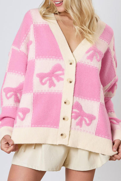 Cardigan con bottoni e scollo a V con motivo a quadretti con fiocco rosa e spalla abbassata