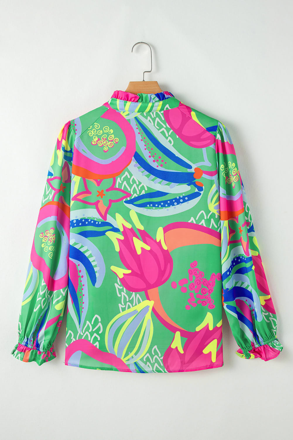 Groene abstracte print gegolfde mouw knoop V -nekblouse