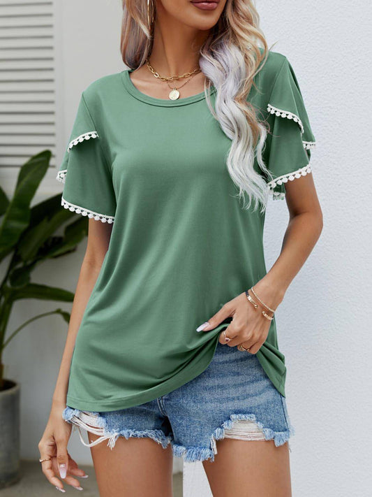 Pom-pom trim fladder hylsa rund hals t-shirt