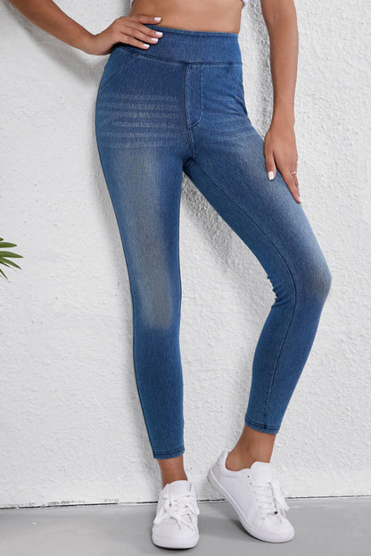 Jeggings ajustados de cintura elástica hasta los tobillos de color azul marino con bolsillos y cintura media