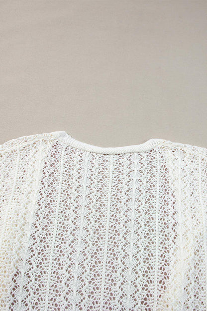 Cardigan bianco elegante con spalle scese in maglia scavata