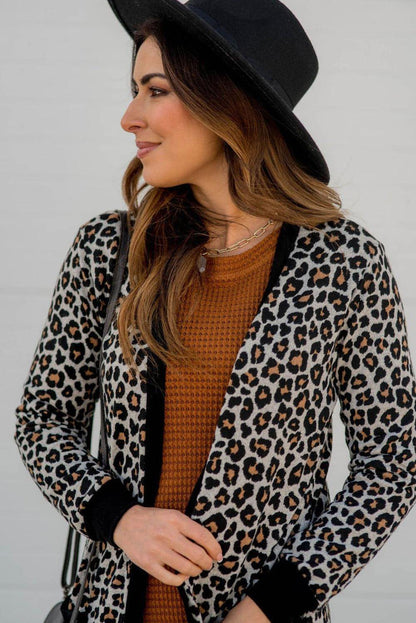 Svart leopard lappad fickan öppen front cardigan