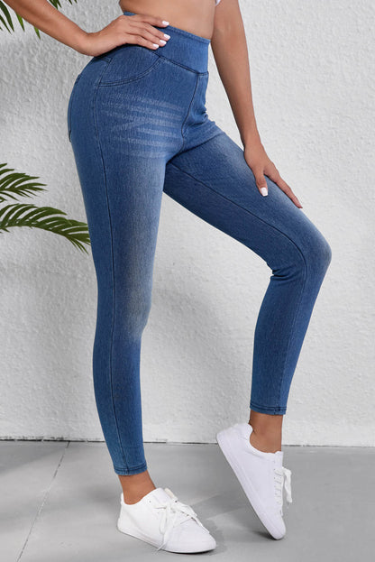 Jeggings ajustados de cintura elástica hasta los tobillos de color azul marino con bolsillos y cintura media