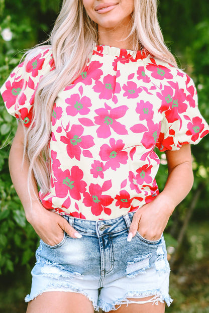 Blusa con escote con volantes y mangas abullonadas con estampado floral beige