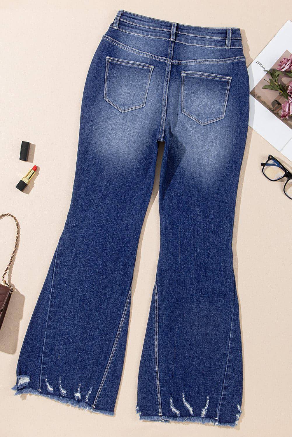 Segla Blue High Rise Dual Button nödställda råa hemsblossade jeans