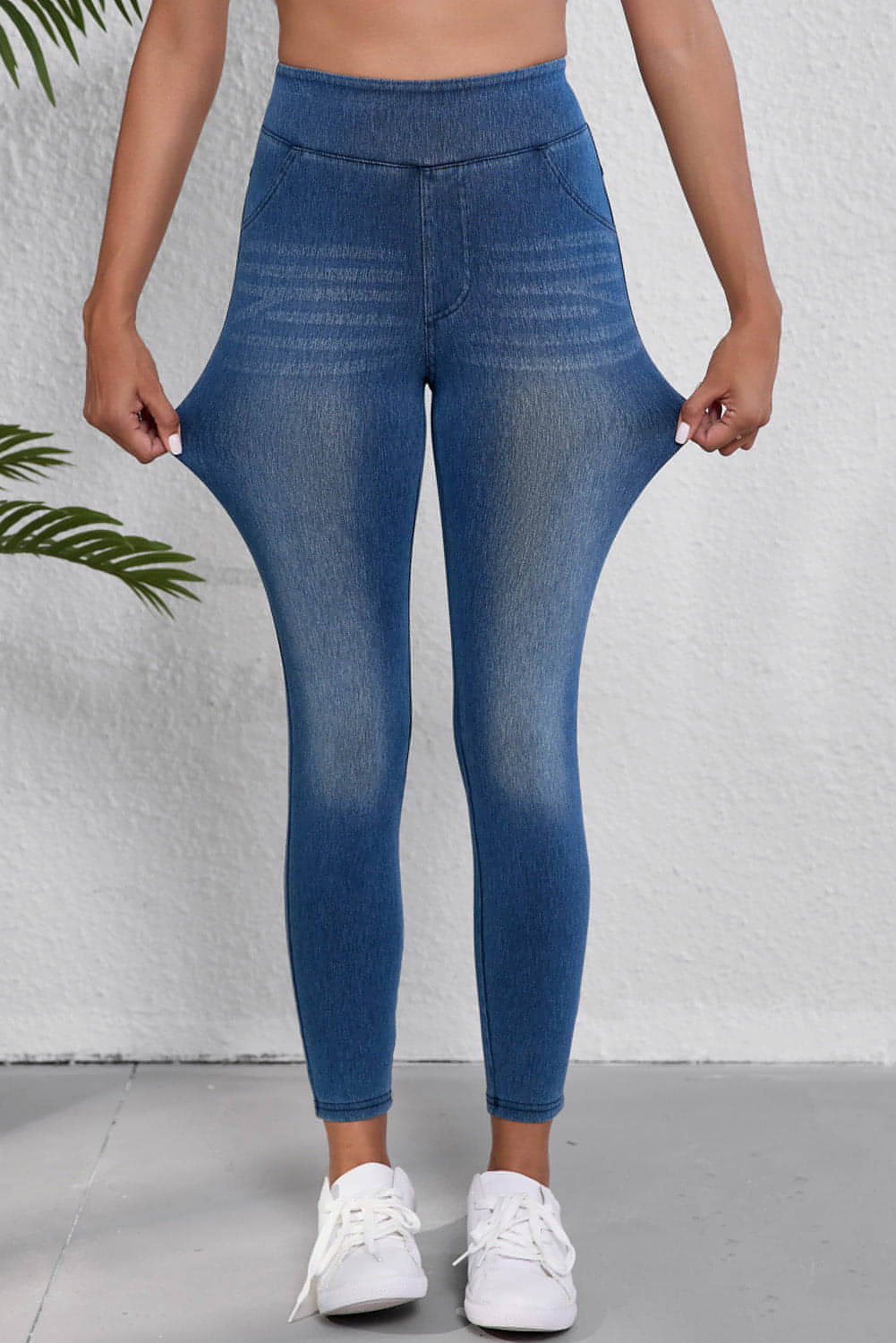 Jeggings ajustados de cintura elástica hasta los tobillos de color azul marino con bolsillos y cintura media