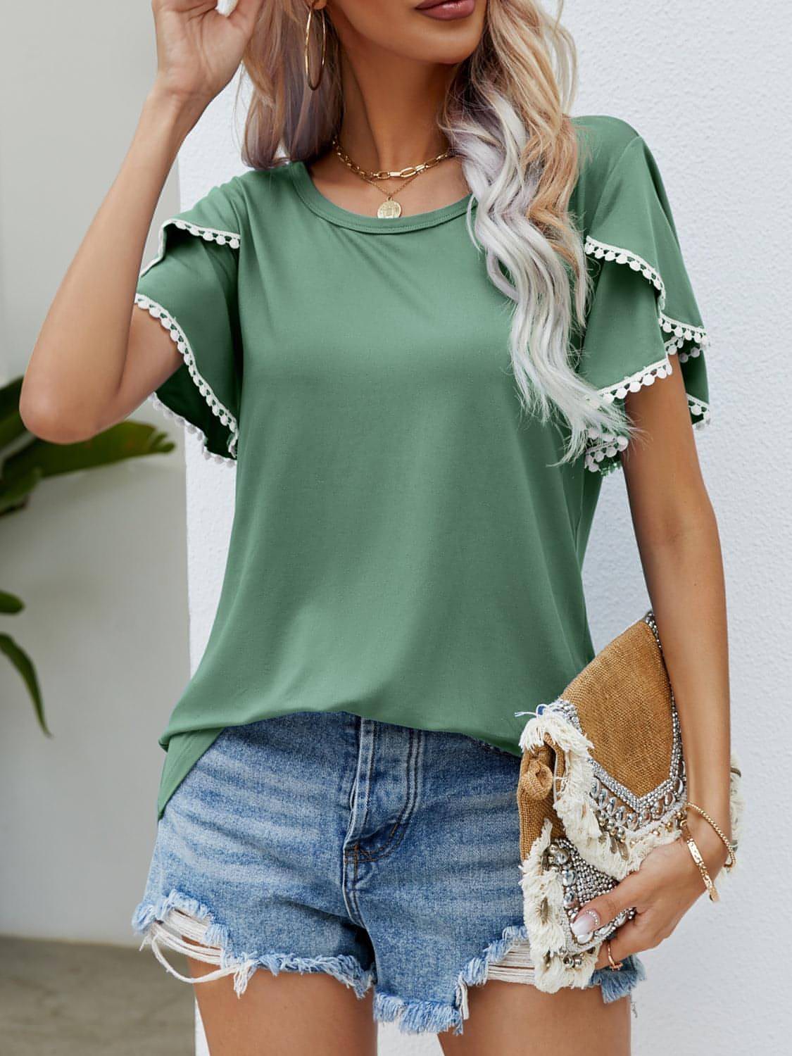 Pom-pom trim fladder hylsa rund hals t-shirt