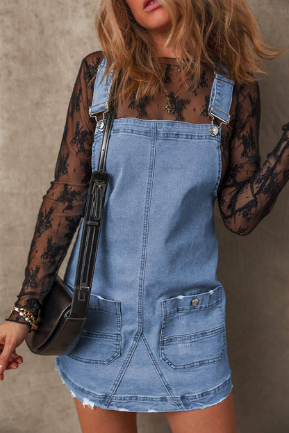 Schemerblauwe denim overall met verstelbare bandjes en zakken