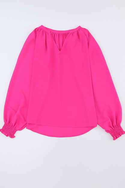 Blusa con escote en V, mangas abullonadas y pliegues en rosa