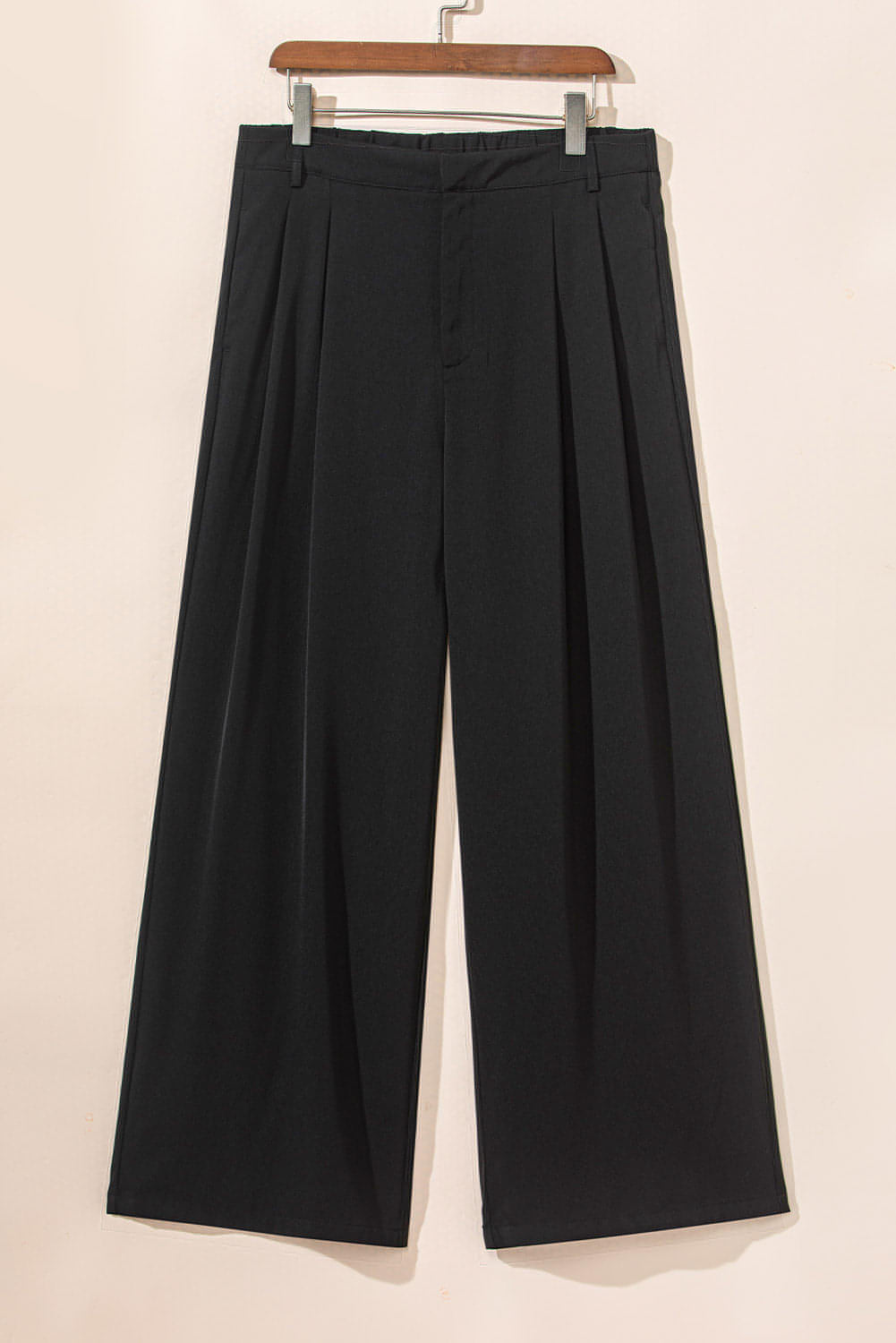 Pantalones anchos elegantes con pliegues negros