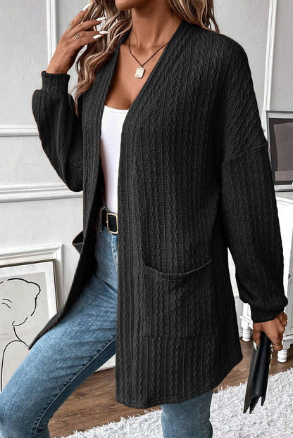 Cardigan noir ouvert sur le devant avec poches latérales en tricot texturé