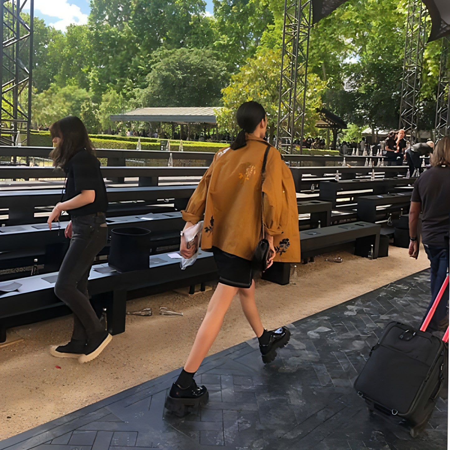 A Woman With A Platform And A Single Shoe