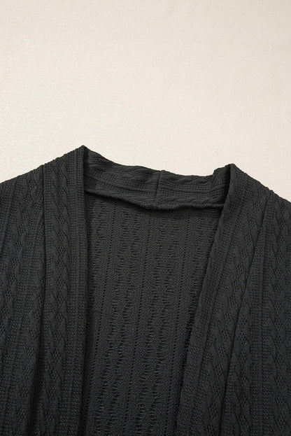 Cardigan noir ouvert sur le devant avec poches latérales en tricot texturé