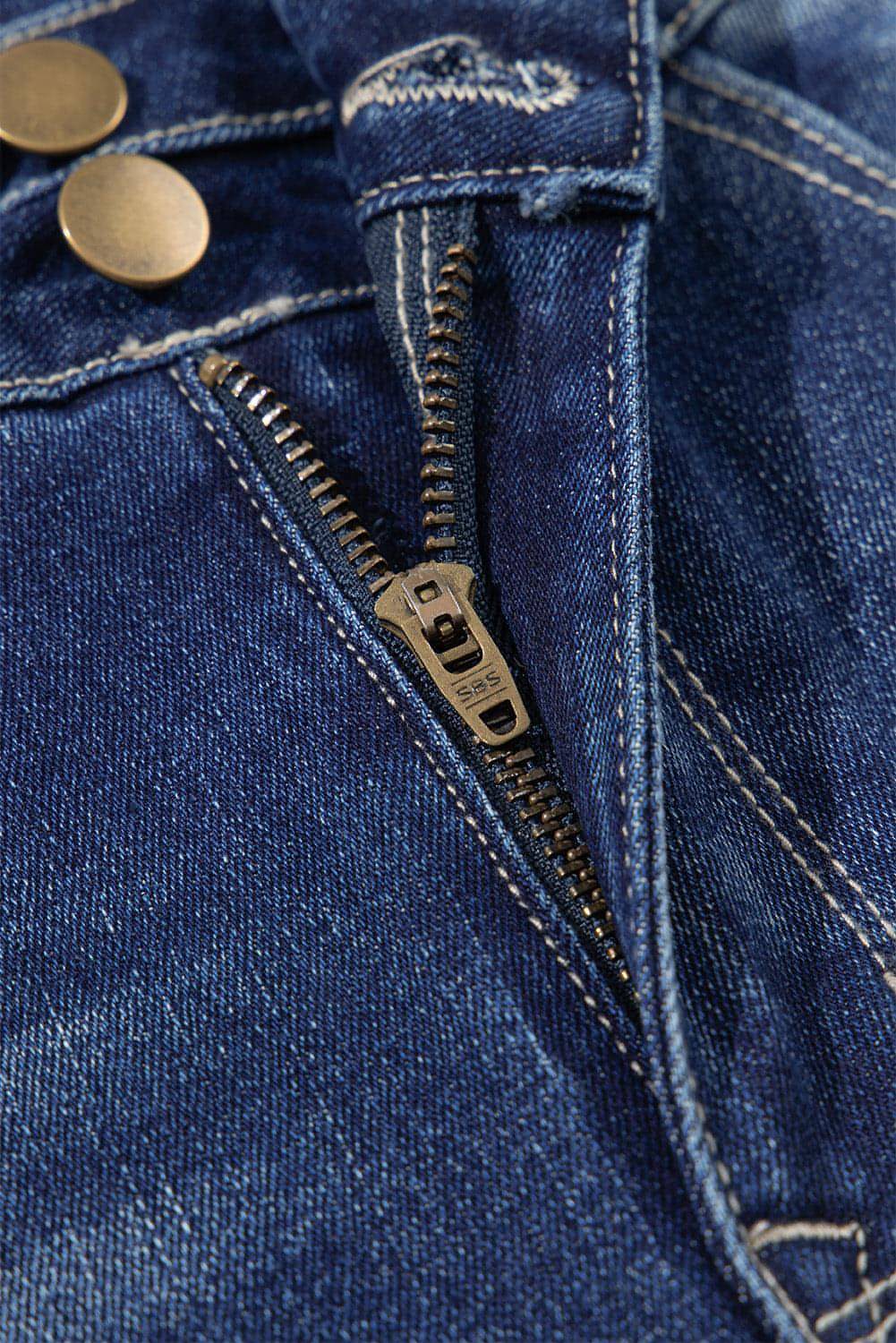 Segla Blue High Rise Dual Button nödställda råa hemsblossade jeans