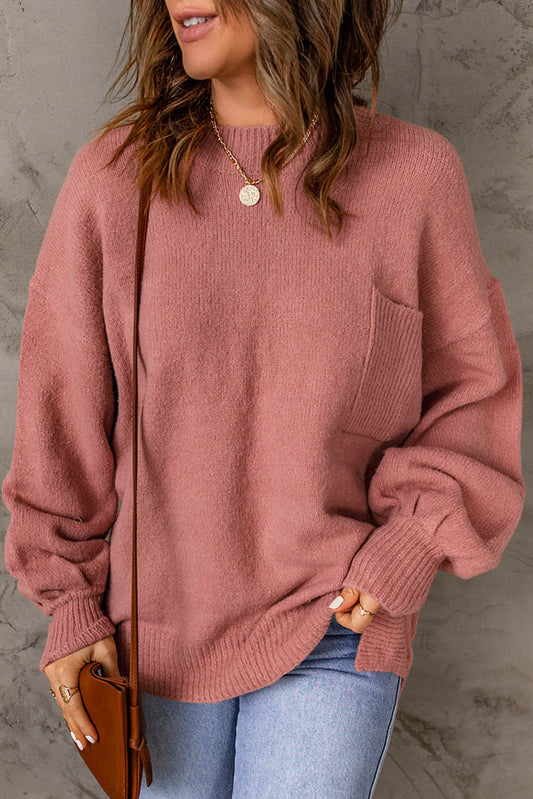 Pull avec poche à manches bouffantes de couleur unie